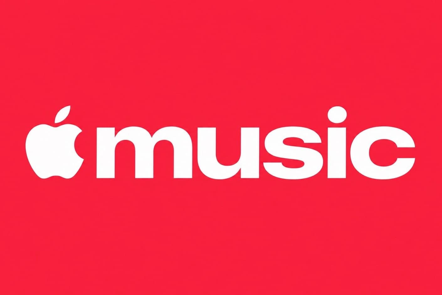 Nowe logo Apple Music: białe jabłko i słowo „music” pisane małymi literami grubym, zaokrąglonym krojem na jednolitym czerwonym tle